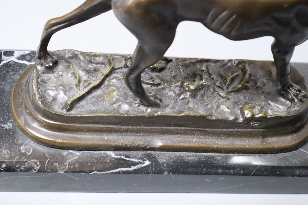 A bronze model of a pointer, unsigned, on marble plinth, length 31cm